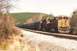 Loaded coal train rolls east